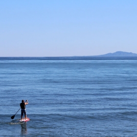 Stand-up Paddle Boarder at Campus Point. Credit: Katharine McLean